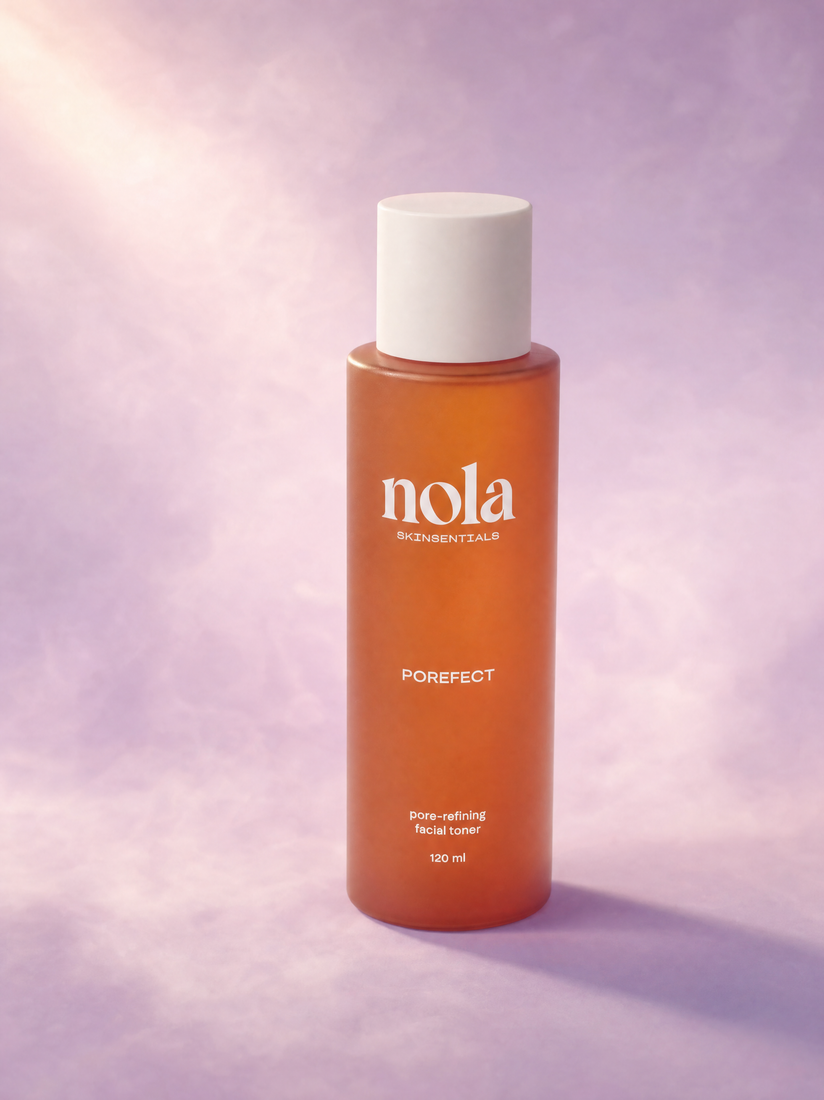 Porefect pore-refining toner by Nola Skinsentials against a dreamy lilac background.