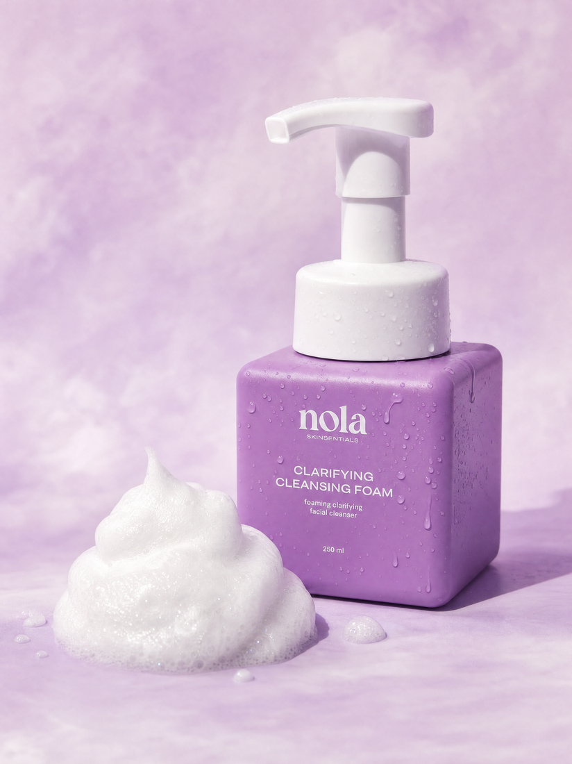 Clarifying Cleansing Foam bottle by Nola Skinsentials with foamy lather.