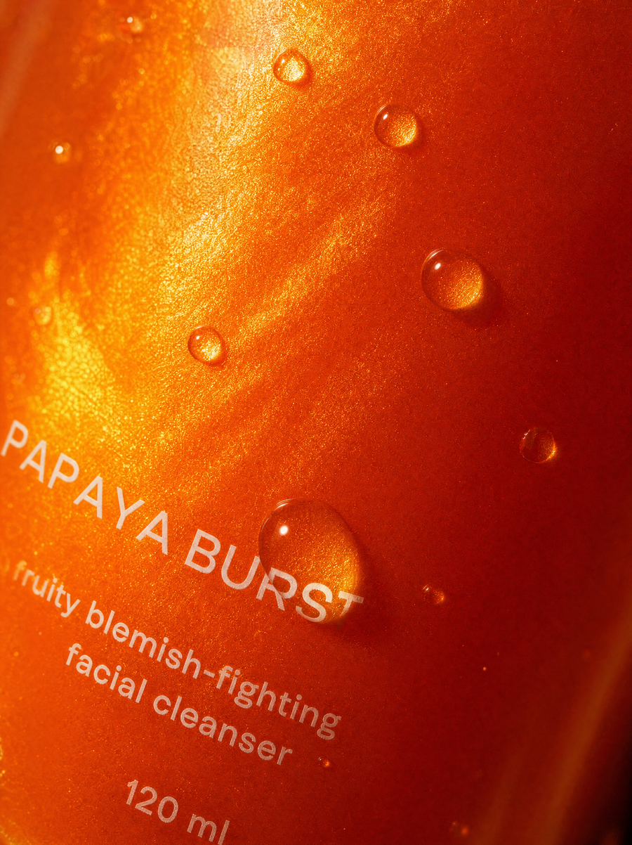 Close-up of the Papaya Burst facial cleanser bottle and pump.