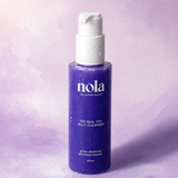 The Real You Jelly Cleanser bottle by Nola Skinsentials on a soft lavender background.