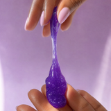Close-up of the stretchy, jiggly purple jelly cleanser texture in hand.