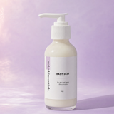 Baby Skin ceramide face wash bottle by Nola Skinsentials on a soft lavender background.