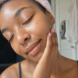 Woman showing soft, glowing skin after using Baby Skin face wash.