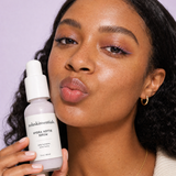 Hydra Hottie Serum by NOLA Skinsentials with close-up of naturally radiant hydrated skin