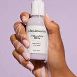 Hydra Hottie Serum milky texture dripping over hand — deep moisture serum by NOLA Skinsentials