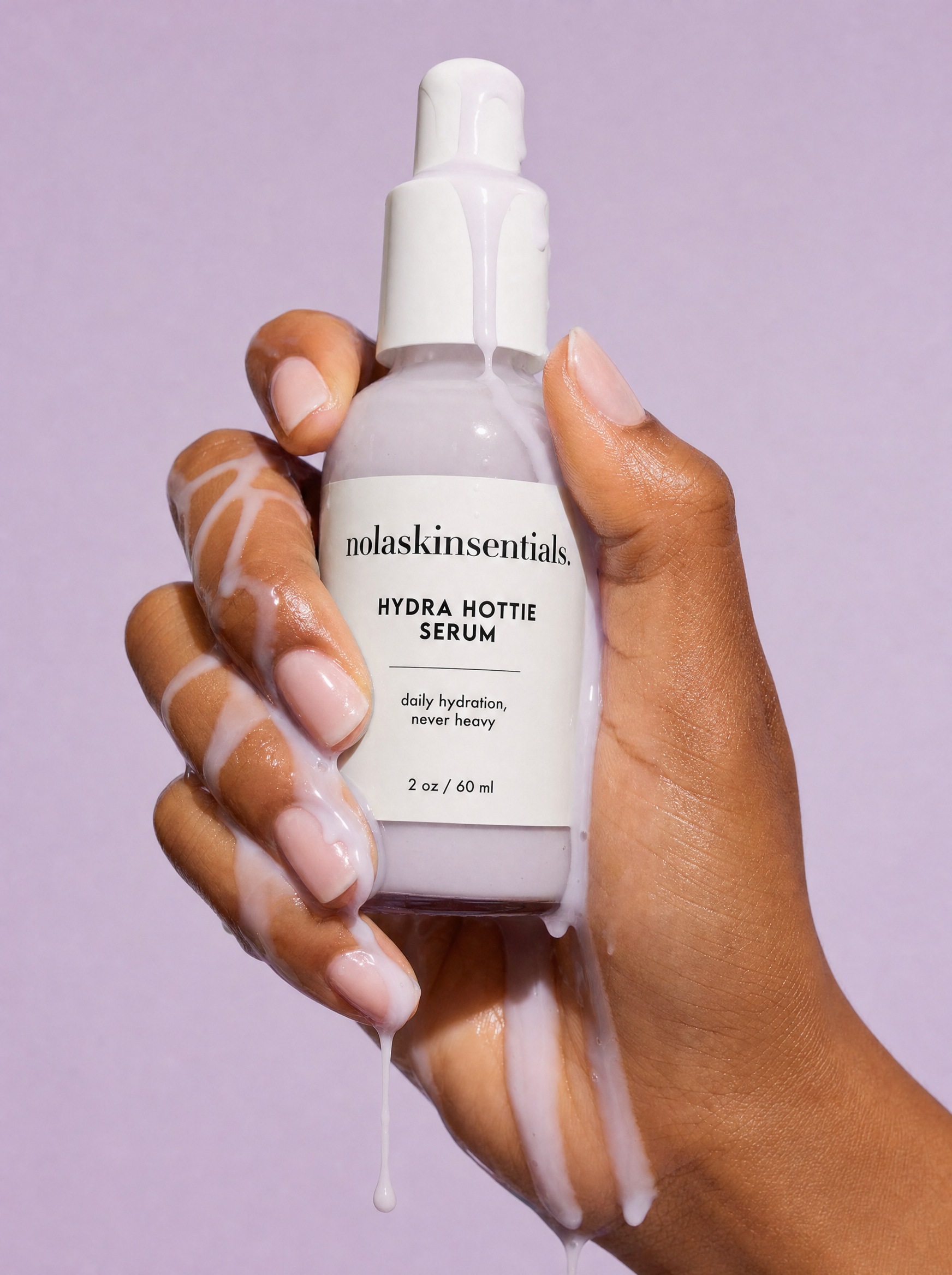Hydra Hottie Serum milky texture dripping over hand — deep moisture serum by NOLA Skinsentials